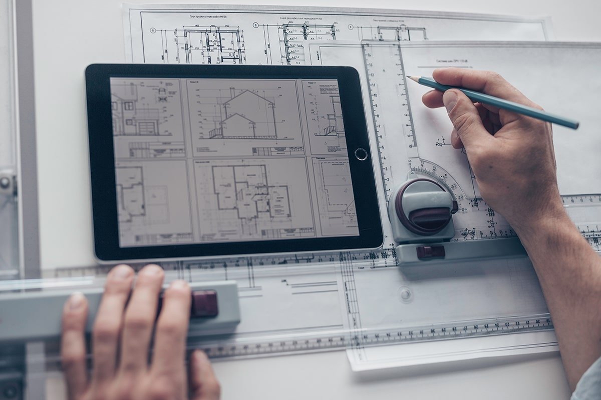 Man working on floor plans